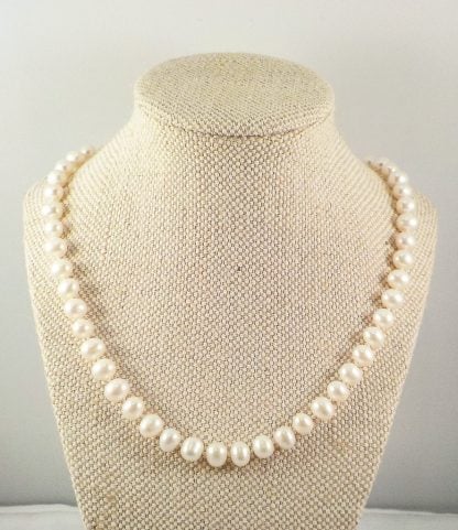 Sumptuous strand of white, freshwater, 'Potato' Pearls with Sterling silver clasp.